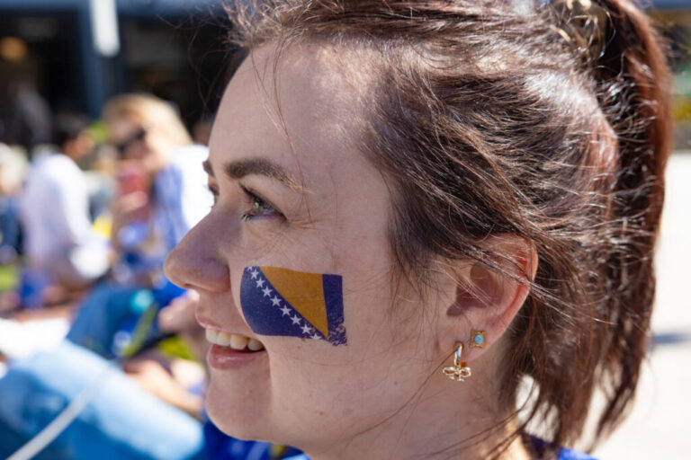 Melita Advic wears a Bosnia-Herzegovina face tattoo on her cheek while awaiting the start of the game at a watch party at Thrive City in San Francisco.