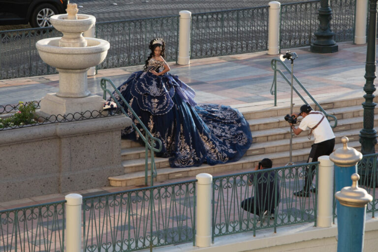 Outside the Venetian in Las Vegas, people take photos for special events because of the architecture that mimics the canals and plazas of Venice.