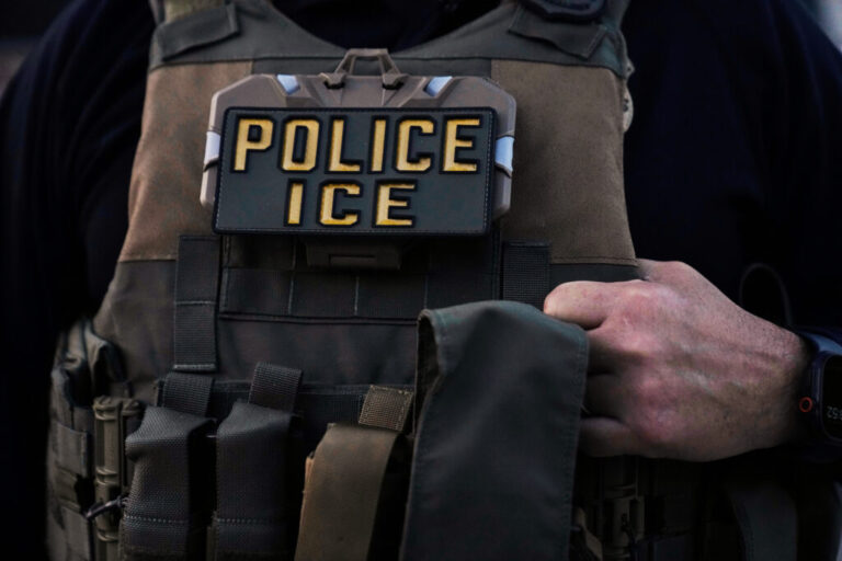 A U.S. Immigration and Customs Enforcement agent is seen in Park Ridge, Ill., Sept. 19, 2025.