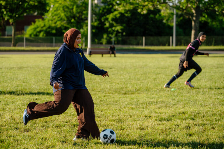 Dearborn, MI - June 11, 2026: The Michigan FC girls' team coach Zharaa Alhamidy, 22, at a practice in Dearborn, MI. (Photo by Nick Hagen for NPR)