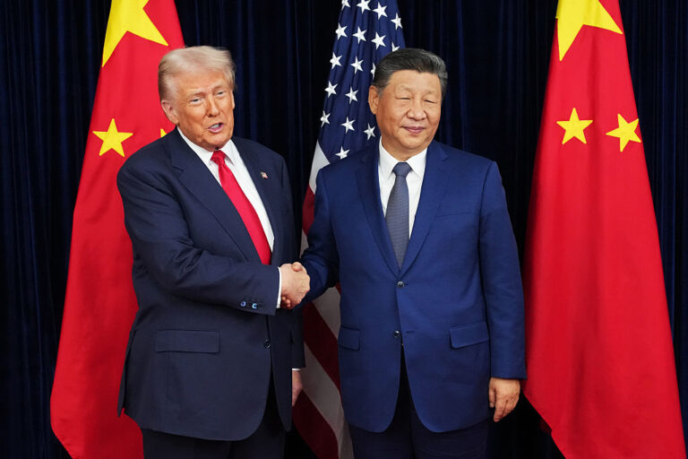 President Trump greets Chinese President Xi Jinping ahead of a bilateral meeting at Gimhae Air Base in Busan, South Korea, on Oct. 30, 2025. Trump heads to Beijing for another meeting with Xi