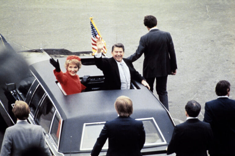Ronald Reagan salutes beside his wife Nancy Reagan during his 1981 inaugural ceremony in Washington, D.C.