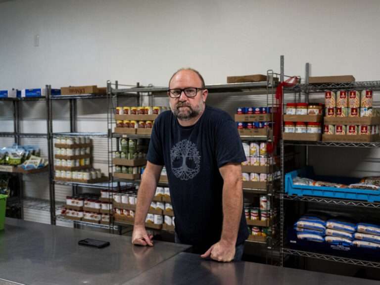Hunter Demster, a community organizer and co-founder of Vecindarios901, inside of a food pantry in First Congregational Church.