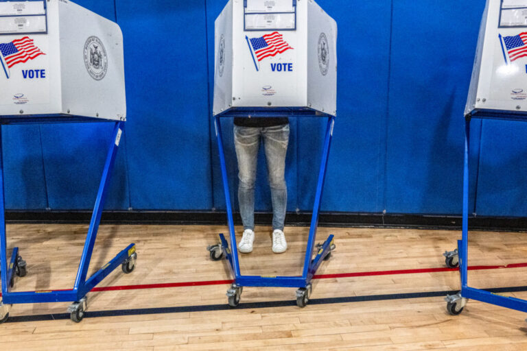 A voter casts their ballot at a polling station in Manhattan's Tribeca neighborhood as New Yorkers head to the polls on June 23 in New York City.