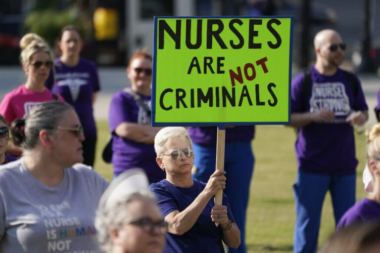 People demonstrate outside the courthouse where the sentencing hearing for former nurse RaDonda Vaught was held on May 13, 2022, in Nashville, Tenn.