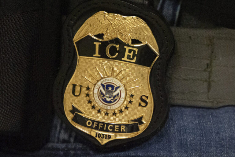 A federal agent wears an Immigration and Customs Enforcement badge in New York, June 10, 2025. The ICE officer who allegedly fatally shot a Colombian man in Maine on Monday was prone to violence and held racist beliefs, according to some of the people who were close to him.
