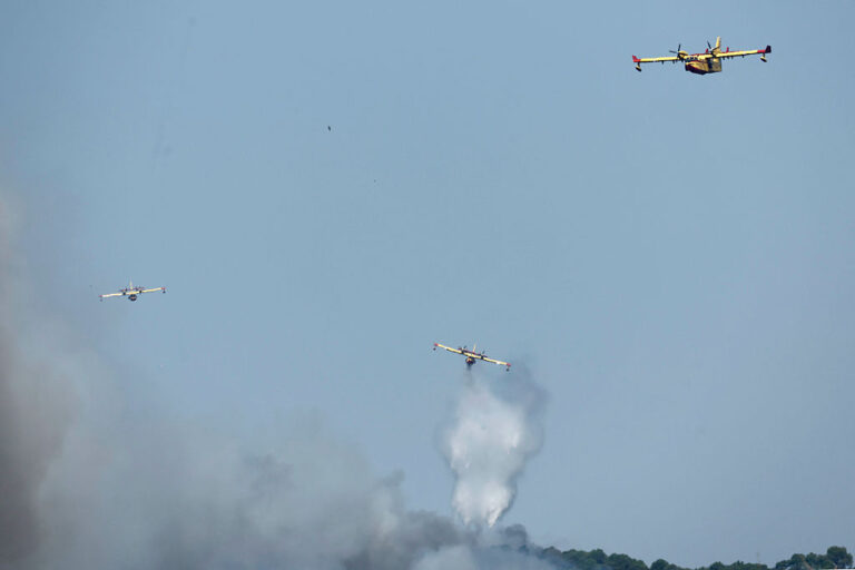 Canadair firefighting aircraft fight a wildfire burning near Pelayos de la Presa, 65 kilometers west of Madrid, on Sunday.