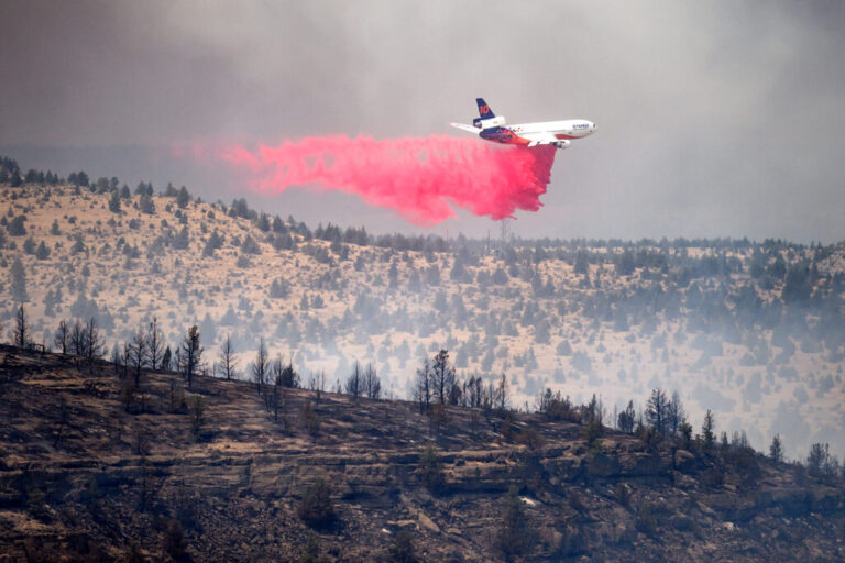 An air tanker drops retardant while battling the Bench fire on Saturday, July 25, 2026, in Jefferson County, Ore.