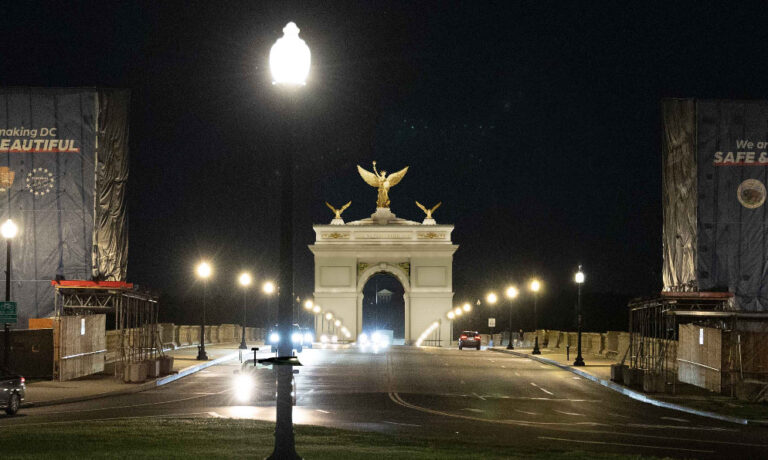 There was no open design competition to select Harrison Design as the architects involved in the 250-foot-tall arch project. Renderings by Harrison Design show the arch at night framing Robert E. Lee's home, Arlington House, behind it.