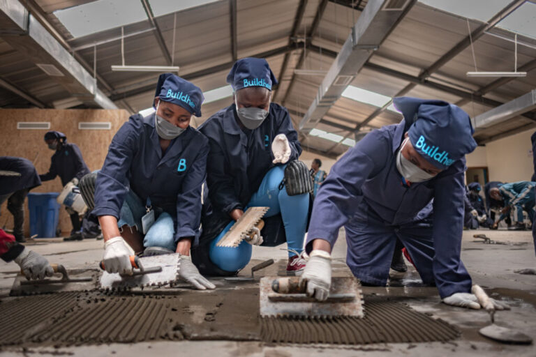 Women take part in a tiling class at the Buildher Academy in Nairobi, Kenya.