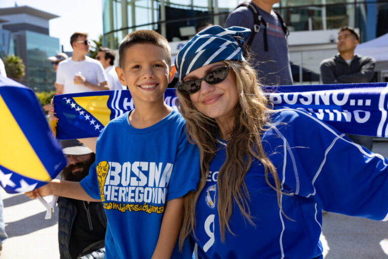 Irma Aguirre and her son Leo, 7, both Bosnia-Herzegovina fans, pose for a photo at Thrive City in San Francisco.