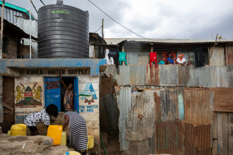 Billy Misuga, 25, works at a government-sponsored water kiosk in Kibera. “People are fighting for water. I let them fill even if they don’t pay,” Billy says.