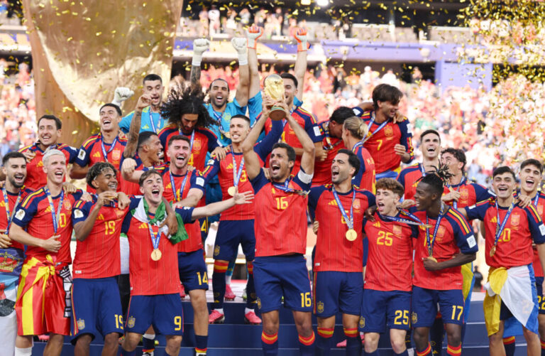Rodri, #16 of Spain, lifts the FIFA World Cup Winner’s Trophy after the team’s 1-0 victory over Argentina in the final at MetLife Stadium in East Rutherford, N.J. on Sunday. It was Spain's second World Cup title.