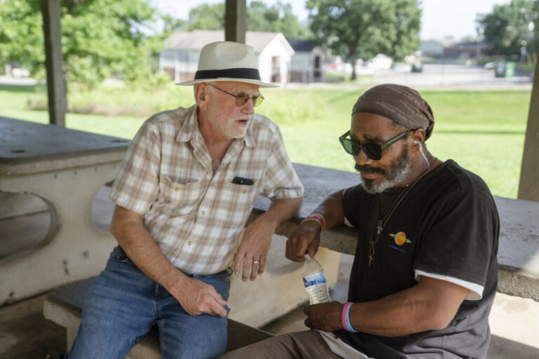 John Lozier sits with Joseph Williams, a chronically homeless man, who was arrested on June 28 and charged with two felony counts of camping on state property after police found him living in a park in East Nashville. Lozier has befriended Williams over the last few years and in early July helped aid Williams's release from jail.