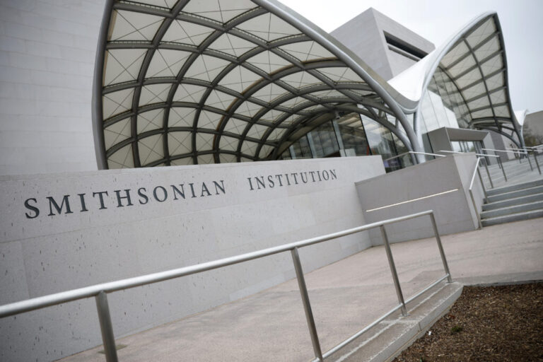 A Smithsonian Institution sign is seen on the National Air and Space Museum on the National Mall in Washington, DC. In March, President Trump signed an executive order to reshape and remove contact that “portrays American and Western values as inherently harmful and oppressive” and promote