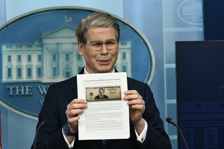 US Secretary of Treasury Scott Bessent shows a proposed $250 bill featuring President Donald Trump during a press briefing in the Brady Briefing Room of the White House in Washington, DC.