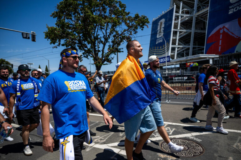 Fans of Bosnia-Herzegovina walk toward the San Francisco Bay Area stadium ahead of the game.