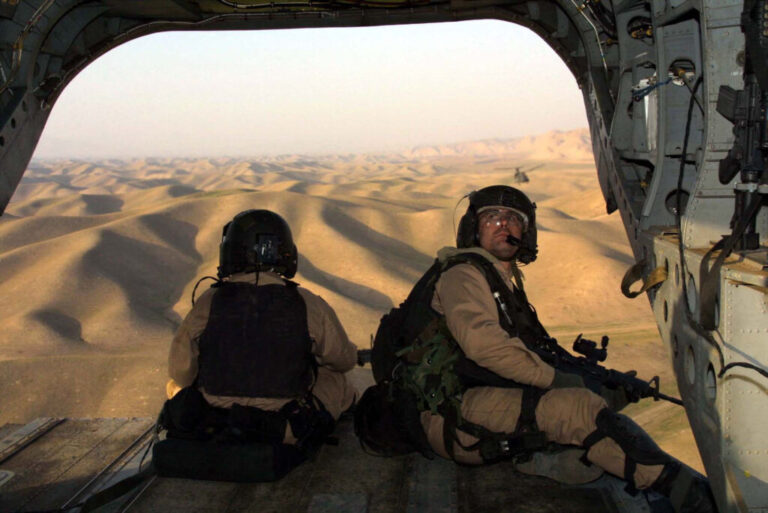 U.S. troops fly over northern Afghanistan in the early days of the war in 2001. The U.S. fought its longest ever war in Afghanistan, for 20 years, only to see the Taliban retake control of the country as the U.S. withdrew in 2021.