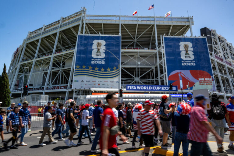 Fans walk toward the San Francisco Bay Area stadium ahead of the match.