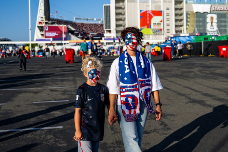 Brenda Moss and her daughter, Rome, 8, leave the FIFA World Cup match between the United States and Bosnia and Herzegovina at San Francisco Bay Area Stadium in Santa Clara, Calif., on Wednesday, July 1.