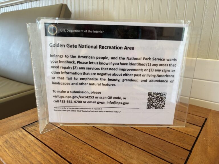 Signs like this one in the Presidio of San Francisco, part of the Golden Gate National Recreation Area, have been going up around the country in response to President Trump's executive order titled