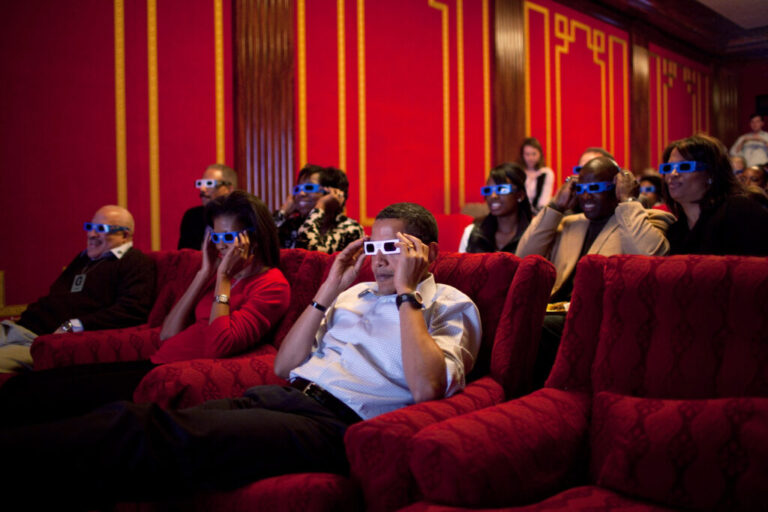 Former President Barack Obama and first lady Michelle Obama wear 3-D glasses during a Super Bowl party in the White House Family Theater in 2009.