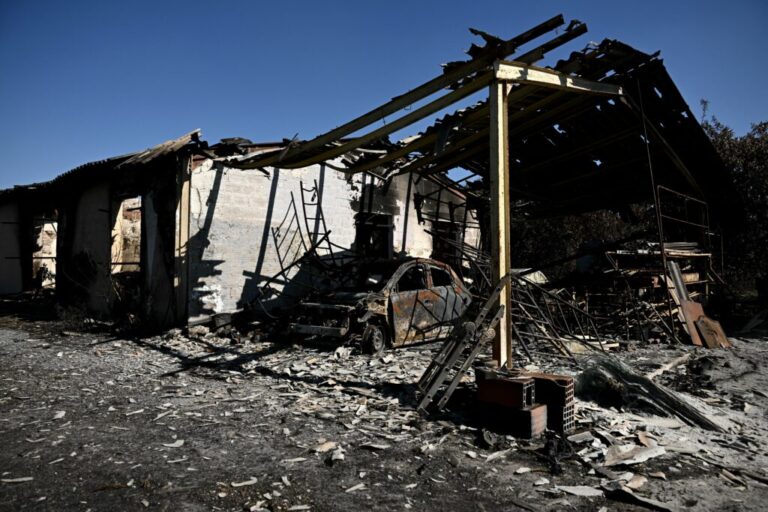 This photograph shows the building of a painting company destroyed by a wildfire in a business park in Biscarrosse, southwestern France on July 28, 2026.