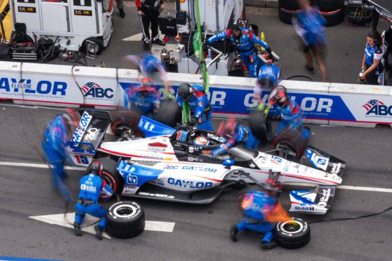 Graham Rahal (15) makes a pit stop during the Freedom 250 Grand Prix auto race, Sunday, Aug. 23, 2026, in Washington.(AP Photo/Allison Robbert)