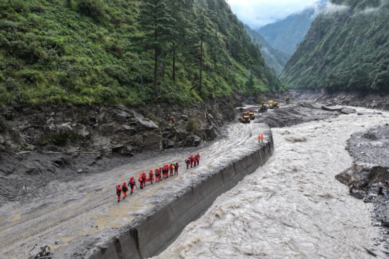 A drone view of firefighters conducting search and rescue operations at a damaged road leading to Gyirong Port after a mudslide, in Gyirong county, Shigatse, Tibet Autonomous Region, China August 28, 2026.