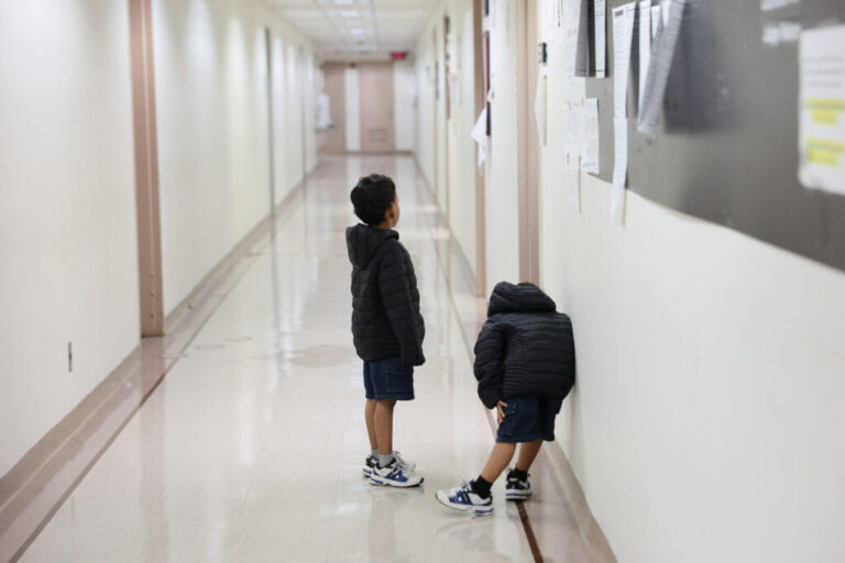 Children wait outside of an immigration court at the Jacob K. Javits Federal Building on July 31, 2026 in New York City.