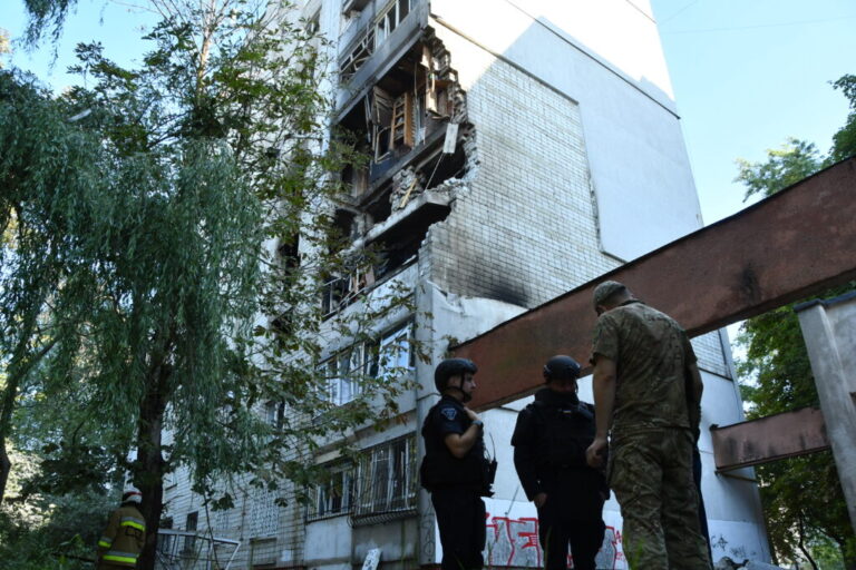 Rescuers work at the damaged apartment building following a Russian air attack in Lviv, Ukraine, Thursday, July 30, 2026.