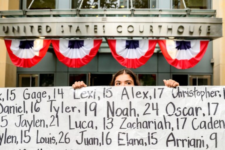 Olivia Konar holds a banner with names of young people who advocates say died as a result of social media outside the Ronald V. Dellums Federal Building and U.S. Courthouse on Tuesday, Aug. 18, 2026, in Oakland, Calif. Her sister Coco Konar died in 2022 when she was 17. Social media company Meta agreed to a nearly $17 billion settlement with a group of states over its child safety practices.