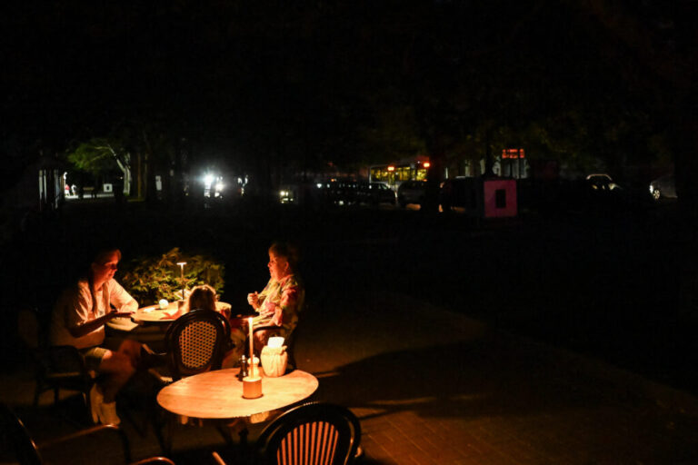 Diners sit at an outdoor restaurant in Sevastopol, Crimea on July 22. Ukrainian drone strikes are causing power outages, fuel shortages and cuts in cellphone service in the peninsula. Russia seized Crimea when it first invaded Ukraine in 2014, but now its hold on the territory is being challenged.