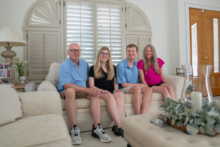 The Brendle family sits on a beige sofa for a portrait at their home. From left to right they are Jim, Kaleigh, Cody and Heather Brendle.