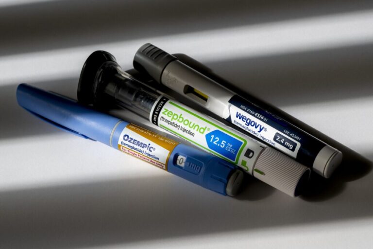 Three GLP-1 medications injection pens are shown displaying the brand names Ozempic, Zepbound and Wegovy.