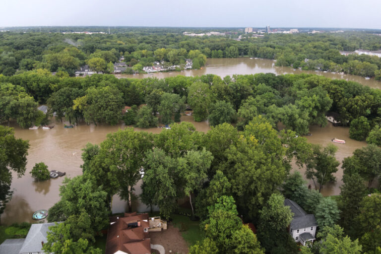 This aerial photo provided by the Indianapolis Fire Department shows flooding in northern Indianapolis, Ind., Saturday, Aug. 15, 2026.