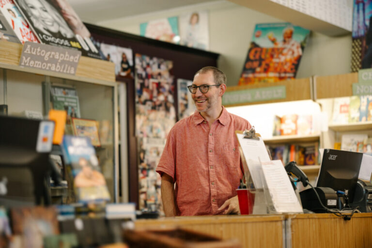 David Logan, store manager of Bookends, a bookstore that has been open since the 1980s, chats with staff on August 7, 2026, in Ridgewood, New Jersey.