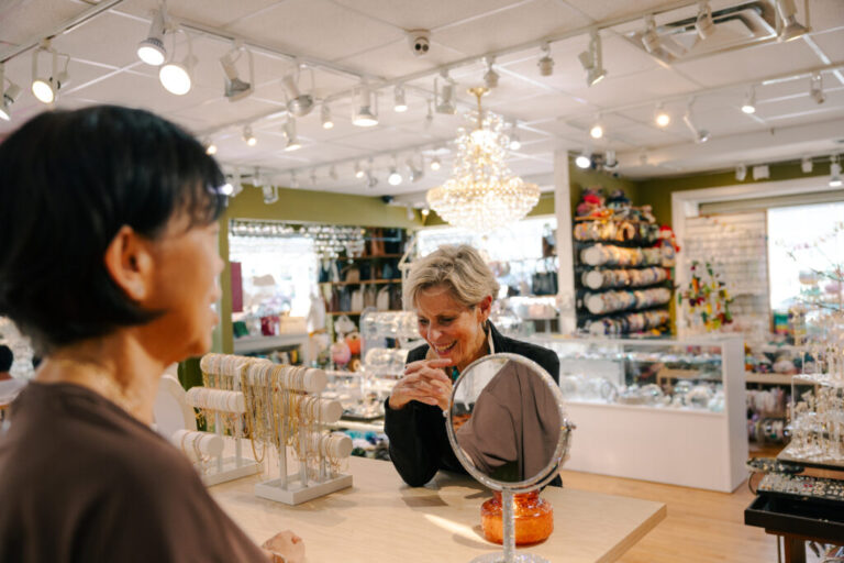 Joan Groome (right), who runs the local Chamber of Commerce, talks with the mother of Gina Jeon, owner of Hot Jewelry Box on Ridgewood Avenue.