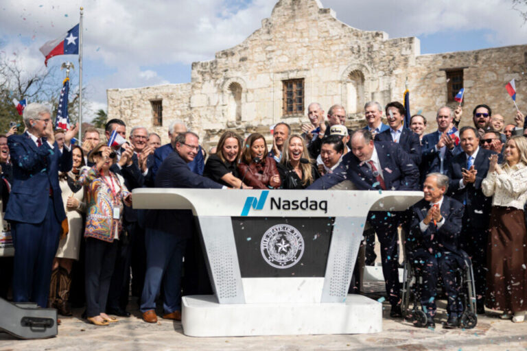 Officials celebrate while ringing the bell during the Nasdaq Texas Closing Bell Ceremony held at The Alamo in San Antonio on Thursday, March 5, 2026. The stock exchange rang the Closing Bell at The Alamo, commemorating the 190th anniversary of the Battle of the Alamo.