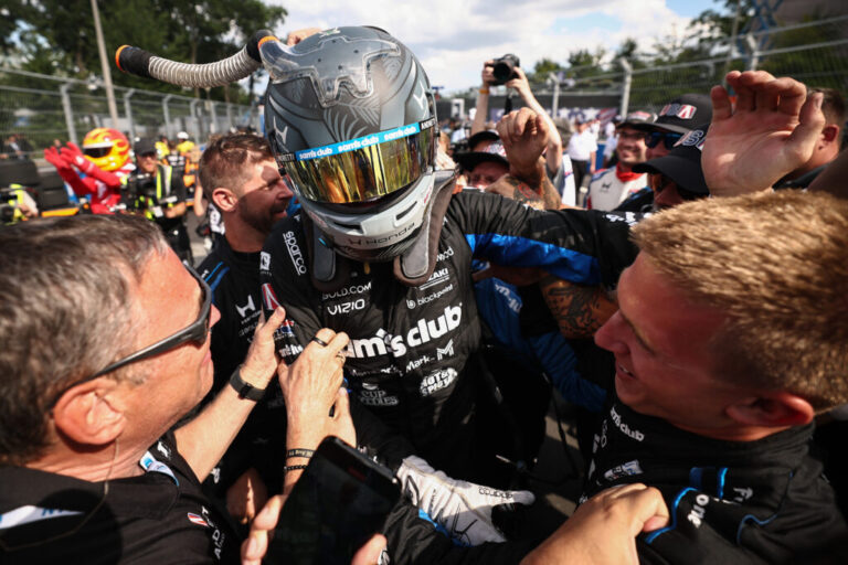 Kyle Kirkwood, driver of the #27 Sam's Club Honda, celebrates with his crew after winning the NTT INDYCAR Series Freedom 250.