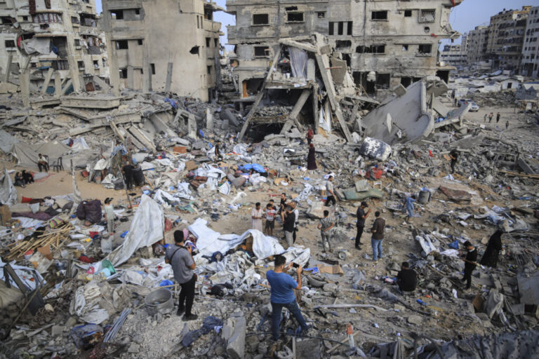 Palestinians search among rubble, damaged tents and household belongings after an Israeli airstrike in the Al-Nasr neighborhood of western Gaza City, on July 30, 2026. The overnight strike hit the Matter family home and destroyed the residential building and the nearby Al-Zuhour displacement camp, where local authorities said around 35 displaced families had been sheltering.