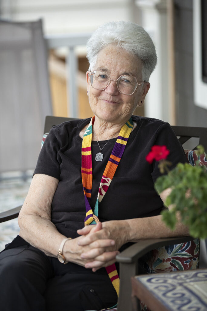 Sister Diane Roche, 76, poses for a portrait on the front porch of Anne Montgomery House that is closing after ten years in Washington, D.C. on July 31, 2026. Sister Diane is part of Society of the Sacred Heart, an international congregation of Roman Catholic religious women, and ran programming at the community house that welcomed young women interested in spirituality and justice.