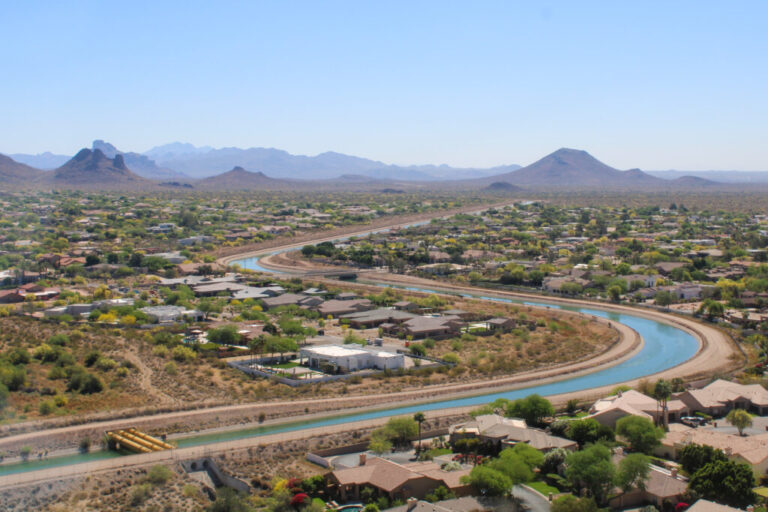 The Central Arizona Project canal winds through Phoenix on March 26, 2026. The 336-mile canal system pumps water from the Colorado River to the Phoenix and Tucson areas. Water supplies for the canal’s users will be cut under a new plan for managing the Colorado River.
