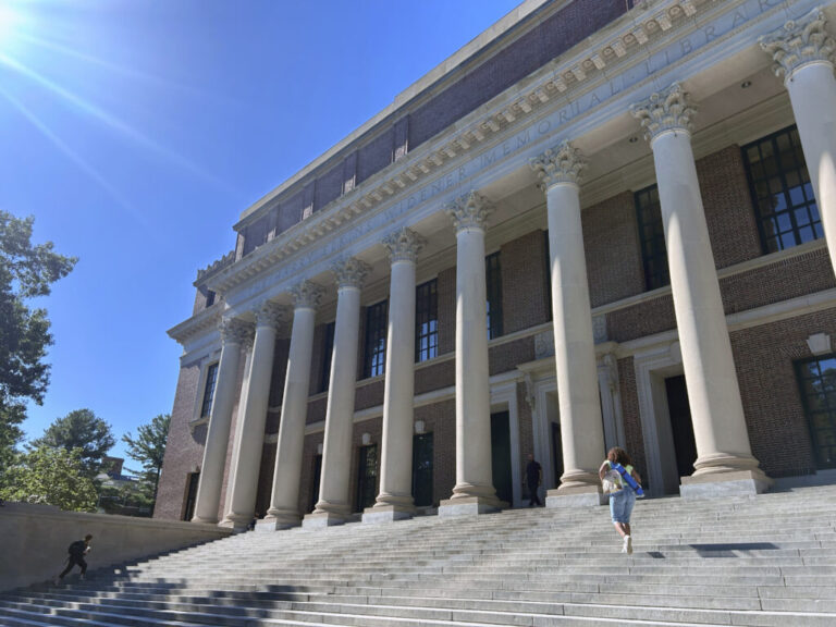 Students walk up the steps of the Harry Elkins Widener Memorial Library on the campus of Harvard University.