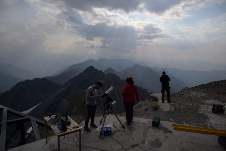 Astrologists from the University of Toulouse prepare equipment ahead of observing a partial solar eclipse on the summit of the Pic du Midi, France.