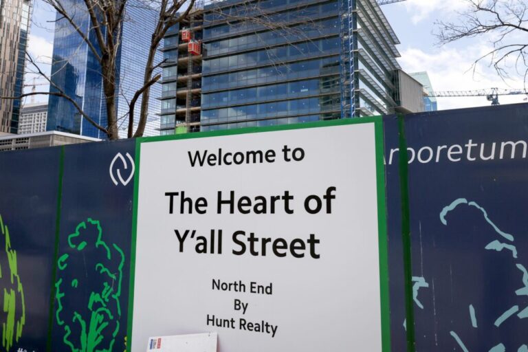 Signage along the construction fence declares the new Goldman Sachs campus as the ‘Heart of Y’all Street’ on Tuesday, March 3, 2026, in Dallas.