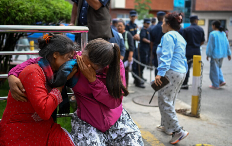 Family members of missing flood victims react at the emergency ward of the Maharajgunj Medical Campus, part of the Tribhuvan University Teaching Hospital  in Kathmandu, Nepal.