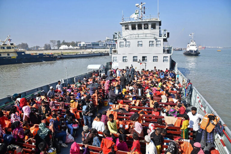 TOPSHOT - Rohingya refugees are seen on a Bangladesh's Navy ship as they are being relocated to Bhashan Char Island in the Bay of Bengal, in Chittagong on January 29, 2021.