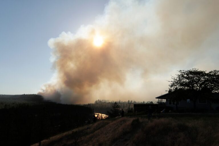 The Old Trails Fire is seen from W. Northwest Blvd., on Aug. 1, 2026, in Spokane, Wash.