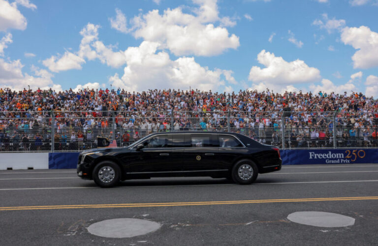 U.S. President Donald Trump rides in the presidential limousine, known as